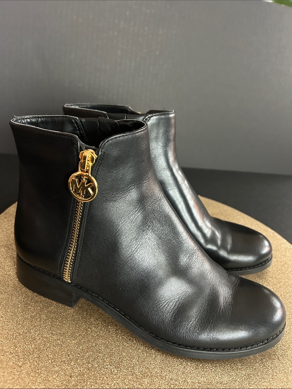 Michael Kors Black Leather Ankle Booties with Gold MK Zip Charm. Like New.